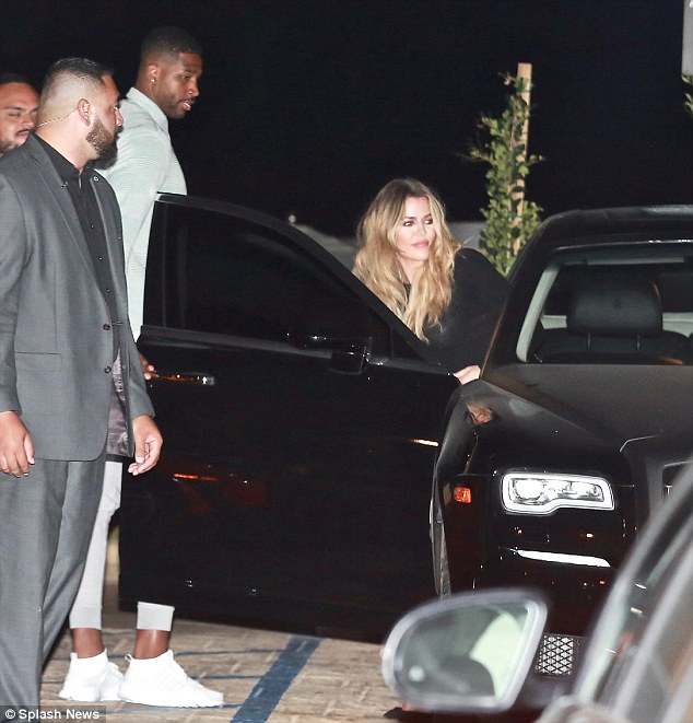 Can't hide her smile! Khloe showed off a grin as she hopped into the car following a romantic date night with Tristan