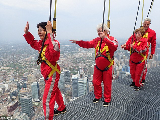 Roz, Grace and Nancy try edgewalking around the CN Tower