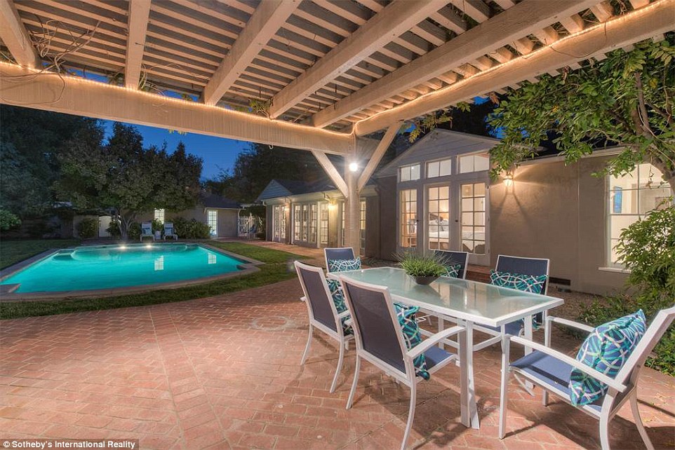Entertaining areas: A dining patio sits adjacent to the large swimming pool