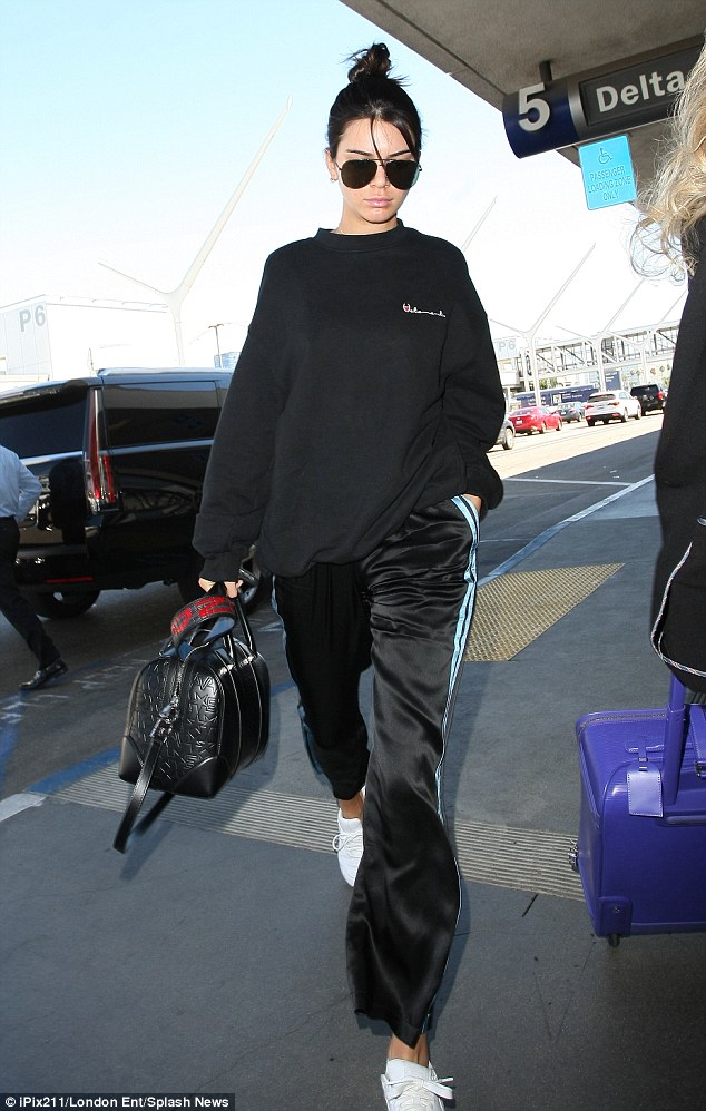 Put your best foot forward: Kendall Jenner, 20, didn't wear any makeup as she readied to leave Los Angeles for Paris to walk in the city's fashion week, which runs from Tuesday thru Friday