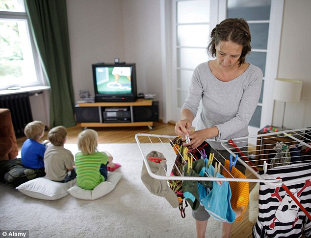 Research shows that females start suffering back and neck pain at a younger age than men – and household chores seem to be partly to blame (File photo)