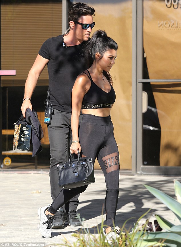Ready for her close-up: Kourtney showed off smoky eyes and nude lips, and had her dark hair in a high ponytail