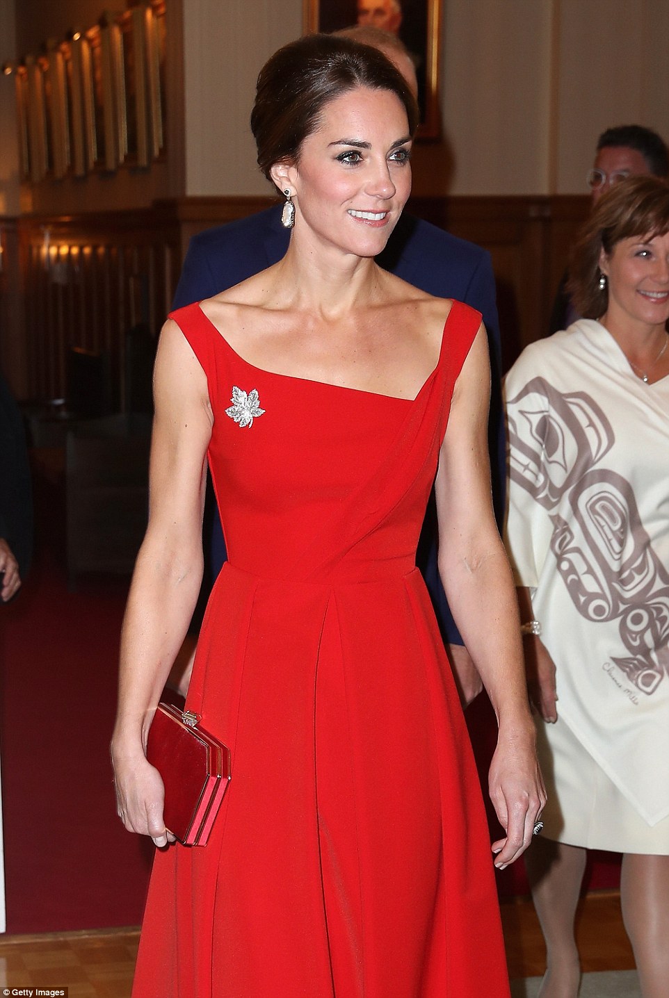 Turning heads: Kate looked stunning in her red dress and maple leaf brooch, paying homage yet again to the Canadian flag after the red and white patterned dress she wore on her first day in the country